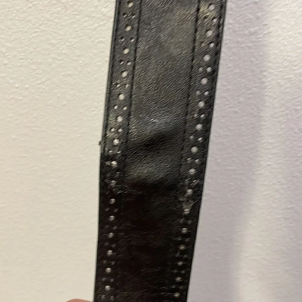 Woman’s black leather belt